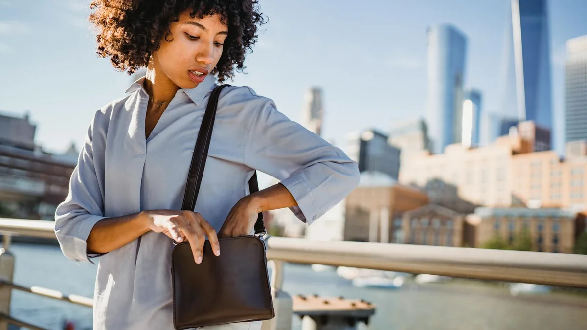 Woman wearing a compact crossbody bag