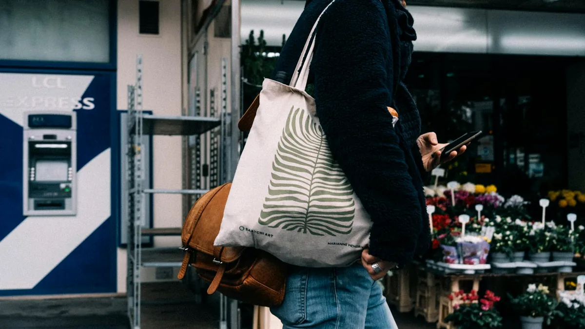 Woman styling a tote bag